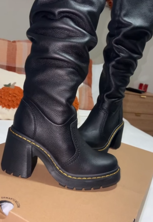 New black leather boots in autumn