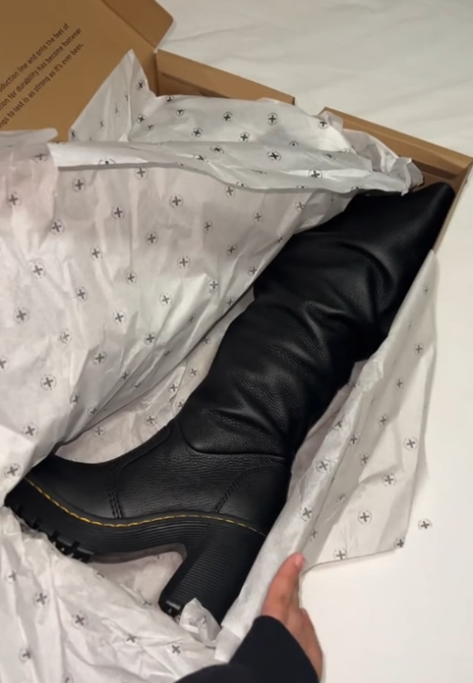 New black leather boots in autumn